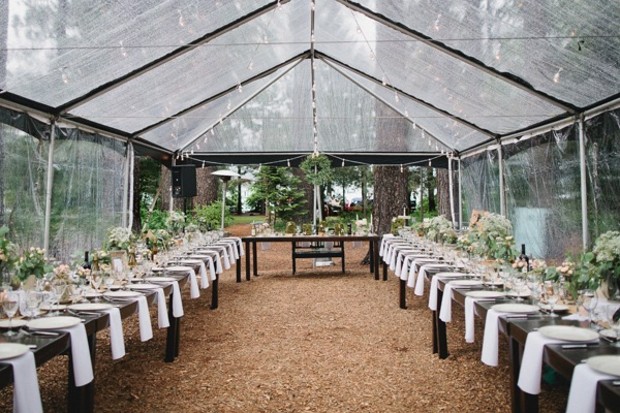 clear tented wedding reception so you can still see the rain