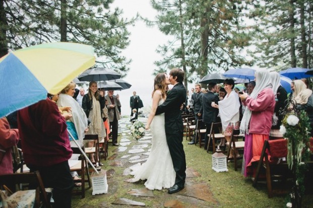 sweet rainy day wedding kiss