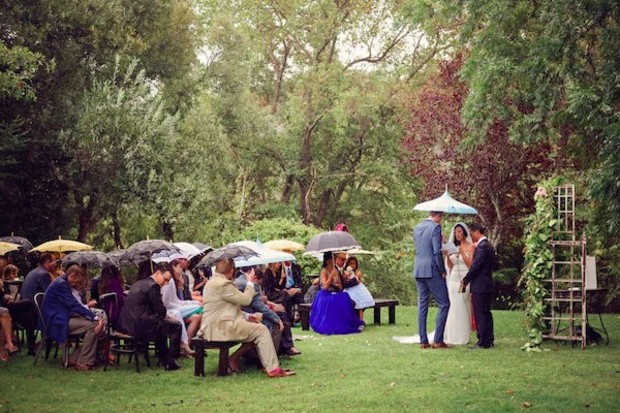 wedding ceremony under umbrellas