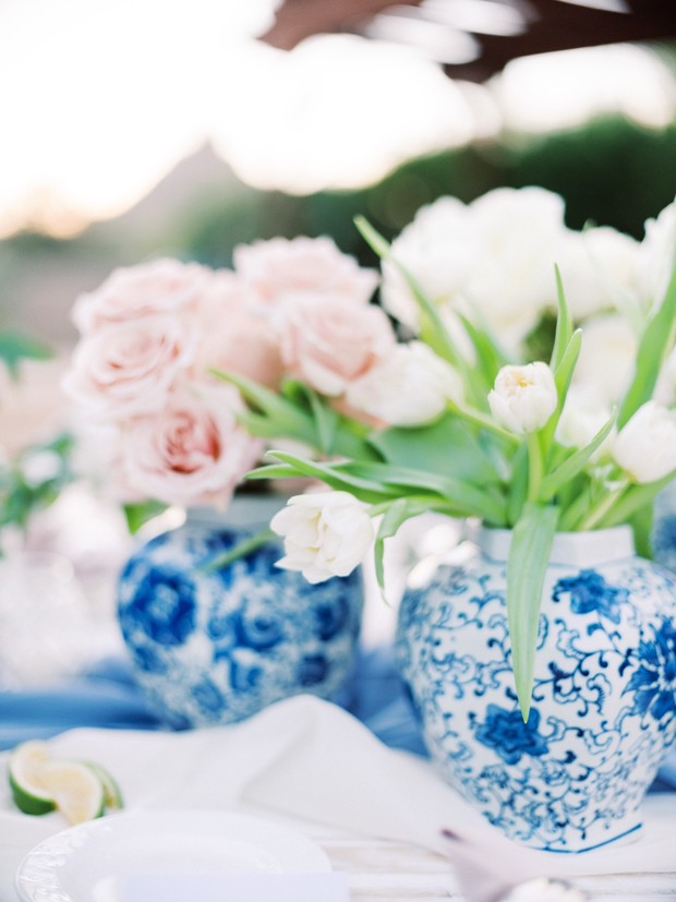 blue patterned vase floral centerpiece
