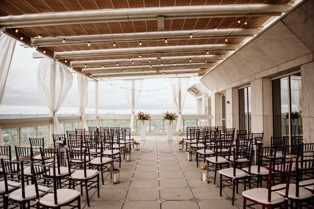 Outdoor wedding ceremony setup with elegant chairs and decor