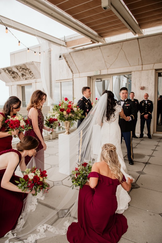Bride and groom at military wedding with bridesmaids and bouquets
