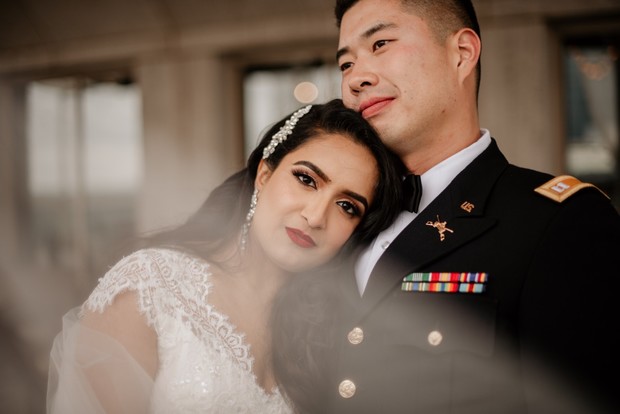 Happy wedding couple, bride with groom in US Army uniform