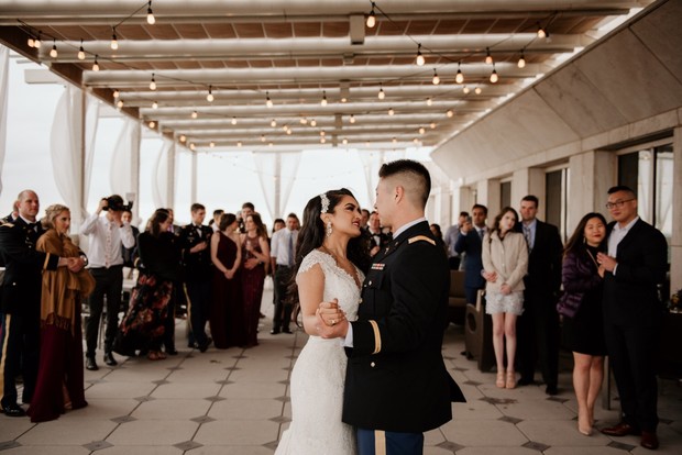Bride and groom share a romantic first dance at their wedding reception
