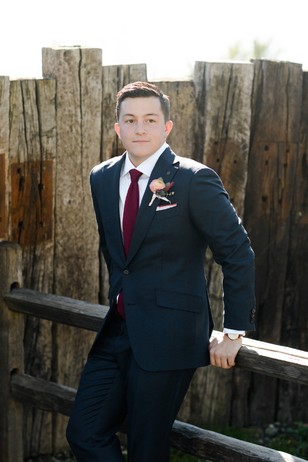 groom style in navy and red