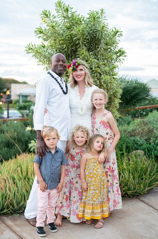 wedding couple in white and wedding kids in fun and funky floral prints