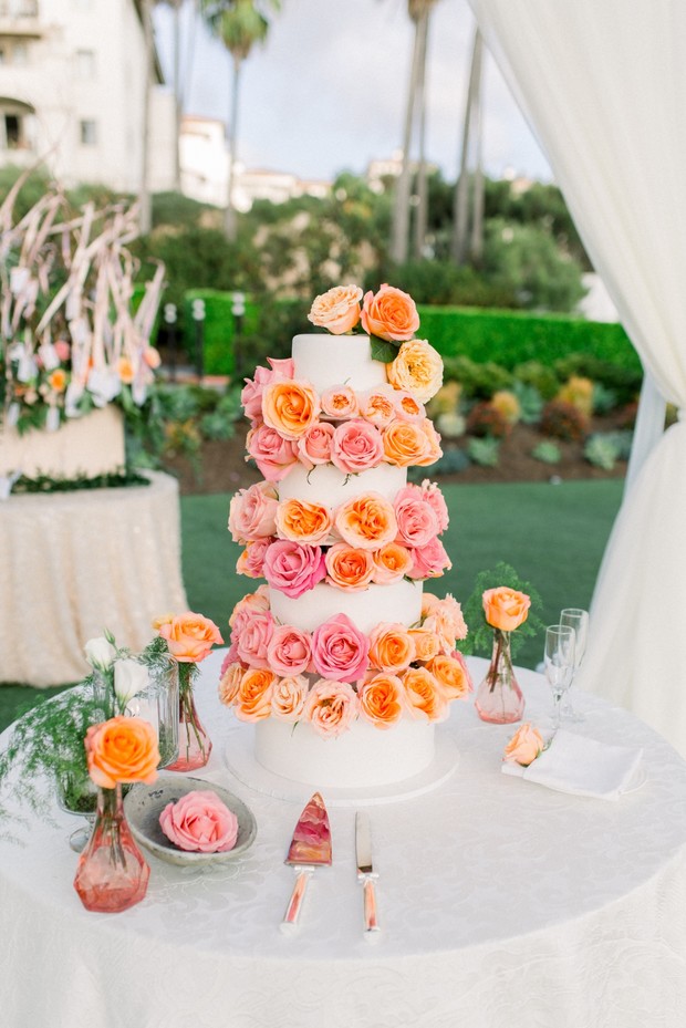 blush and peach flower accented wedding cake