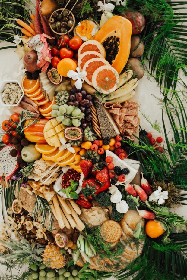 Exotic fruit and cheese grazing board appetizer display