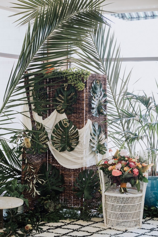tropical monstera leaf wedding seating assignment