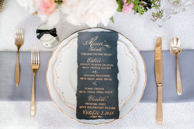 black menu with gold calligraphy