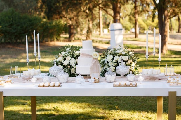white and gold wedding dessert table