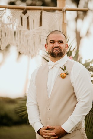 groom in white and tan