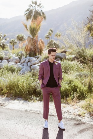 groom in mauve cropped suit and white adidas
