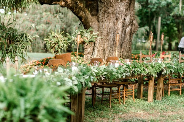 greenery covered wedding table