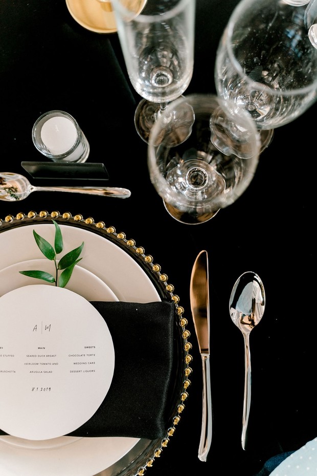 gold and black modern place setting