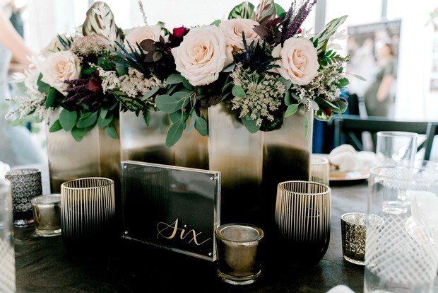 modern and masculine table number and centerpiece