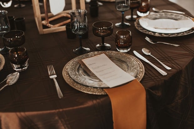 silver and burnt orange place setting
