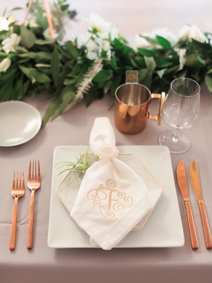copper and white and grey place setting
