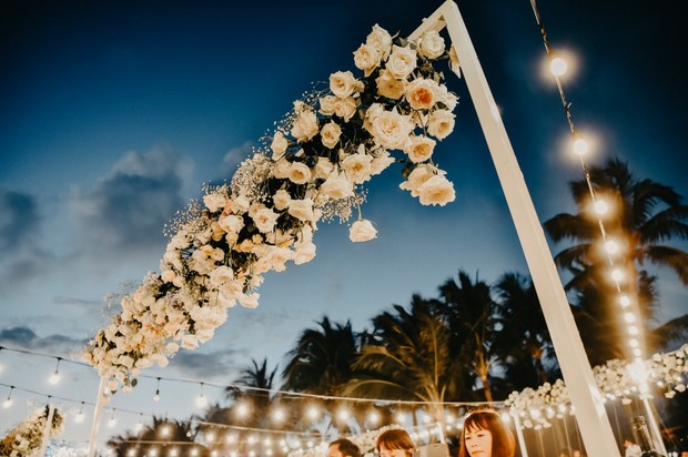 hanging floral decor over reception tables