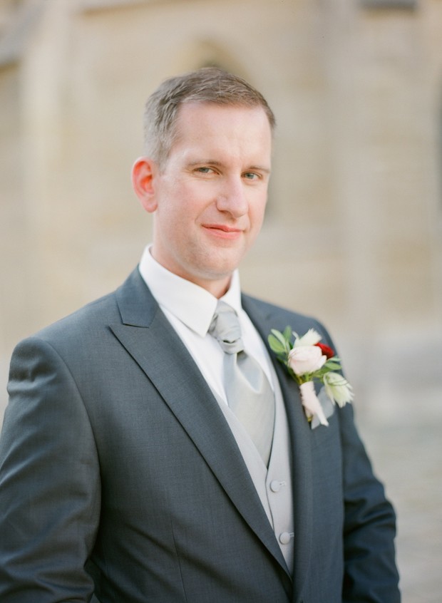 groom in grey and silver
