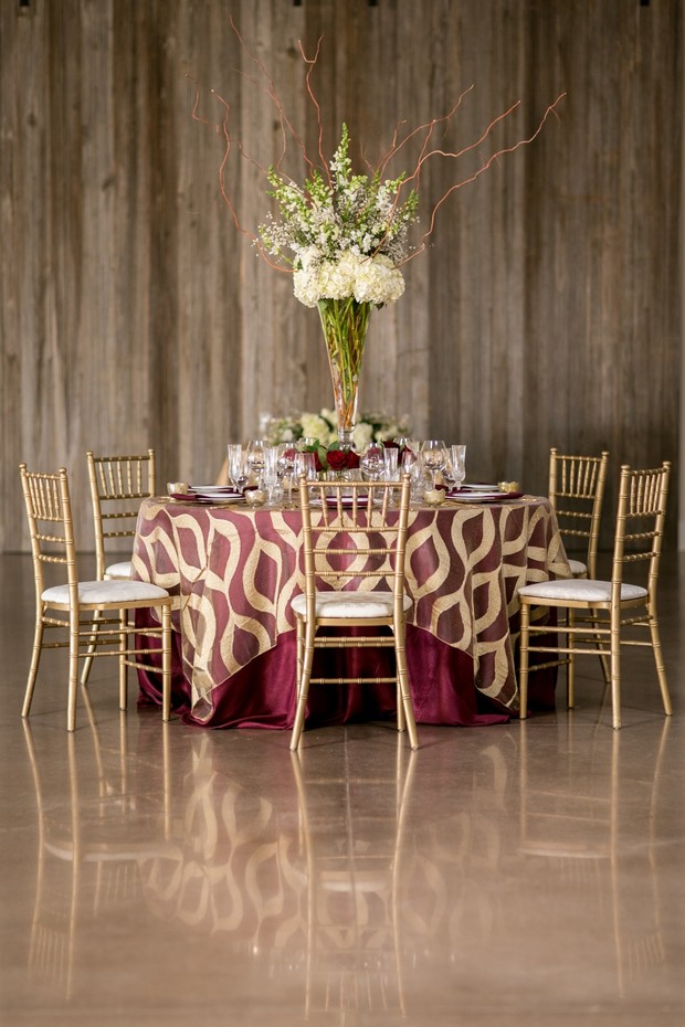 elegant gold and burgundy wedding table decor