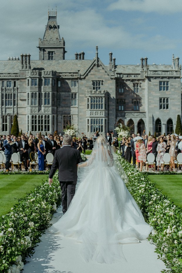 Bride walks down aisle at Adare Manor wedding