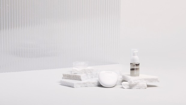 Minimalist skincare products in clean white studio