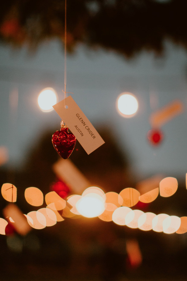 Close up of a sparkling red heart ornament with a name tag
