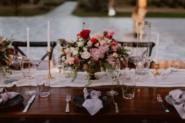 Elegant table setting with floral centerpiece and candles