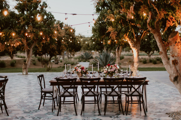 Elegant outdoor wedding table setting with string lights