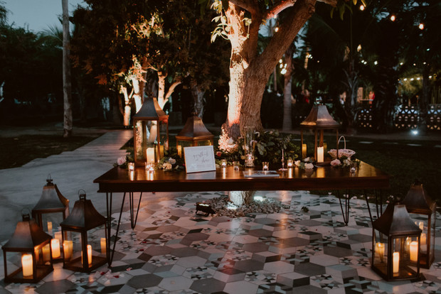 Romantic outdoor wedding reception with candles and lanterns
