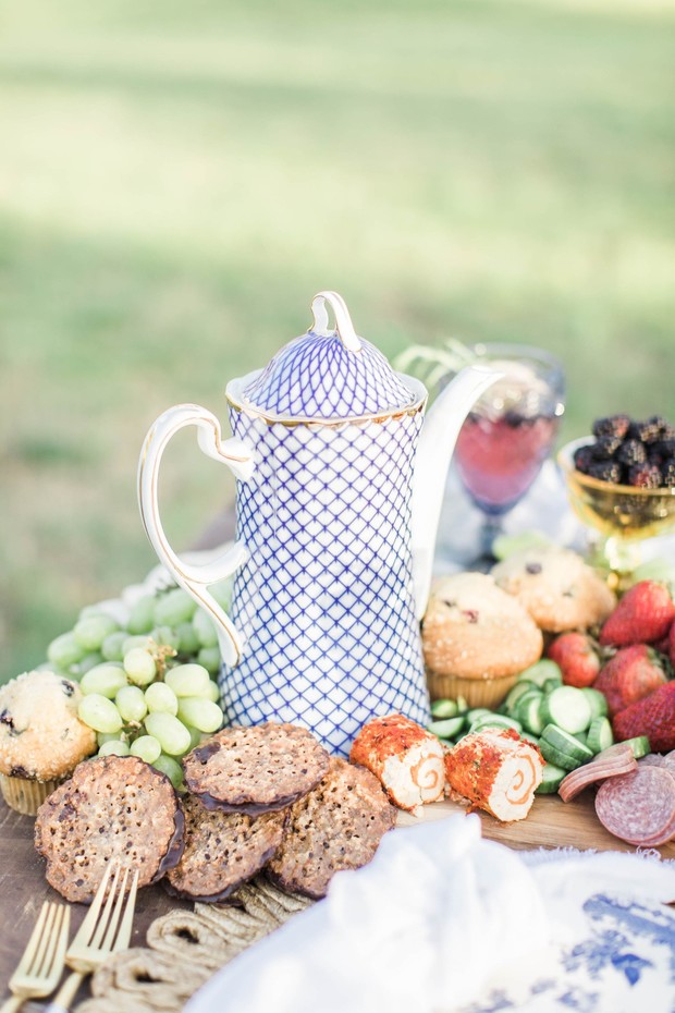 Outdoor tea party with muffins and assorted fruits