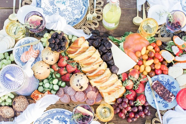 Elegant charcuterie board with fruits cheeses and pastries