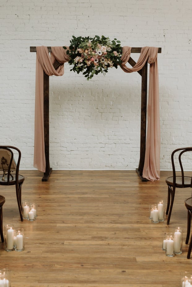 wedding ceremony backdrop with DIY flowers