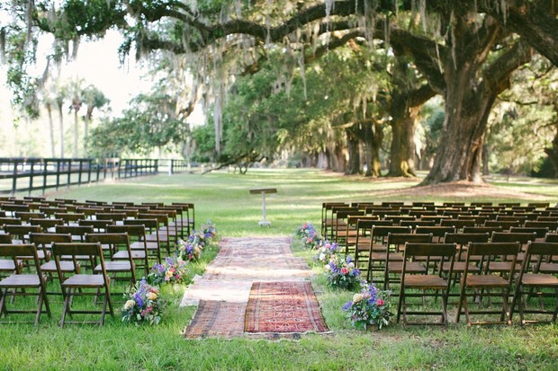 Outdoor wedding ceremony under moss draped oak trees