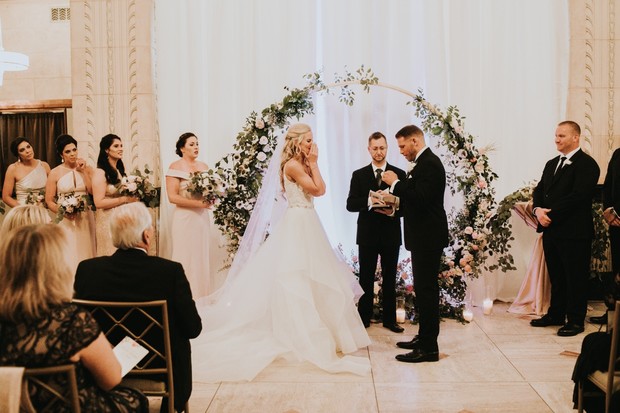 Bride cries tears of joy exchanging vows with groom wedding
