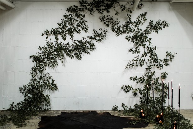 Elegant wedding decor with vines and black candles