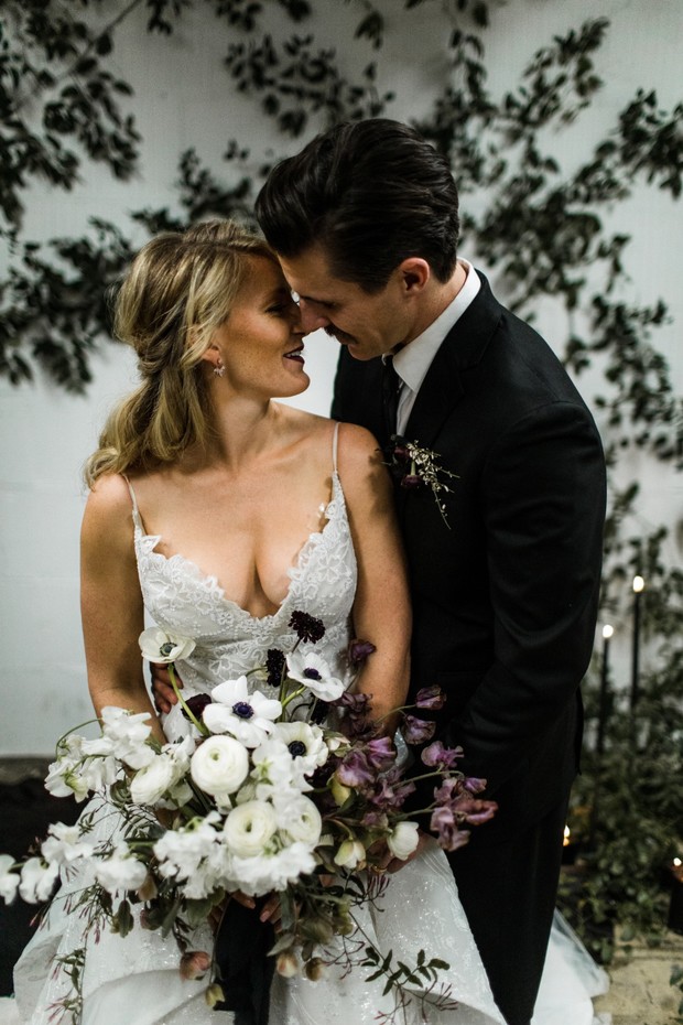 Happy bride and groom embrace on their wedding day