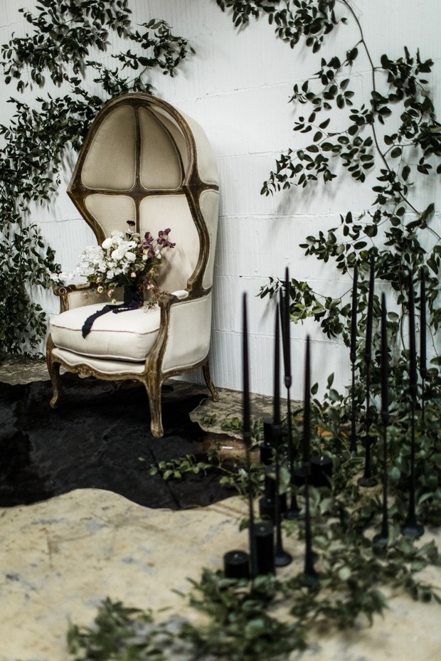 Elegant chair with flowers and black candles decor