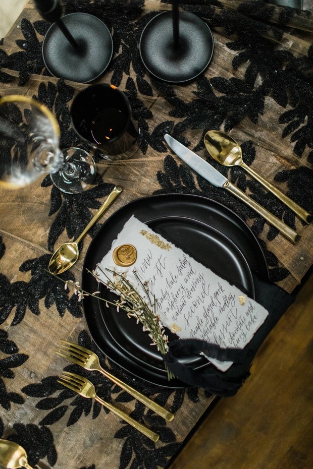 black and gold wedding place setting