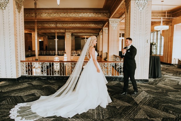 Bride walks to groom for first look on wedding day