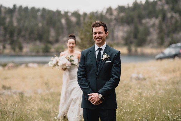 Groom awaits bride for emotional first look outdoors