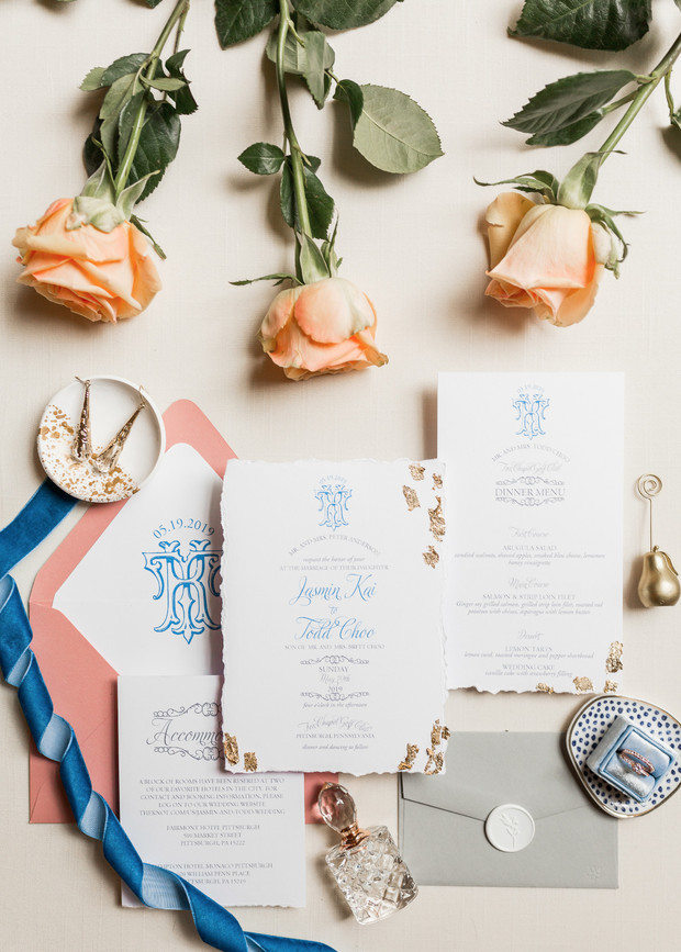 Elegant wedding invitation suite with peach roses decor