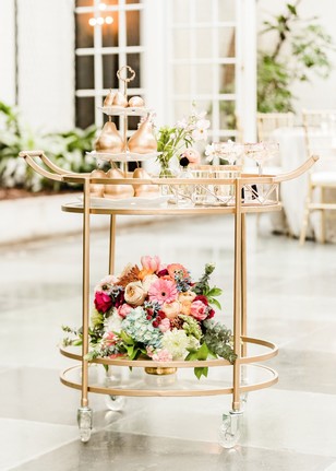 Gold bar cart with flowers and golden decorative pears