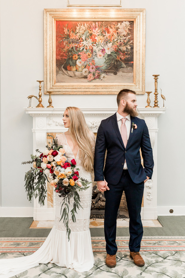 Bride and groom pose for wedding photo