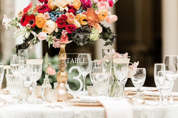 Elegant wedding table setting with colorful floral centerpiece