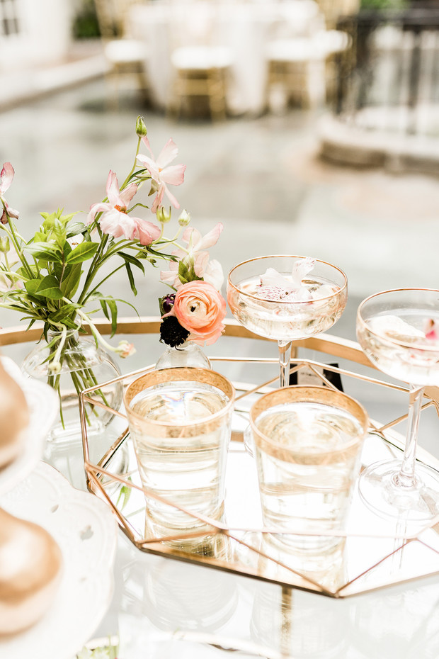Elegant beverage cart with floral arrangement and drinks