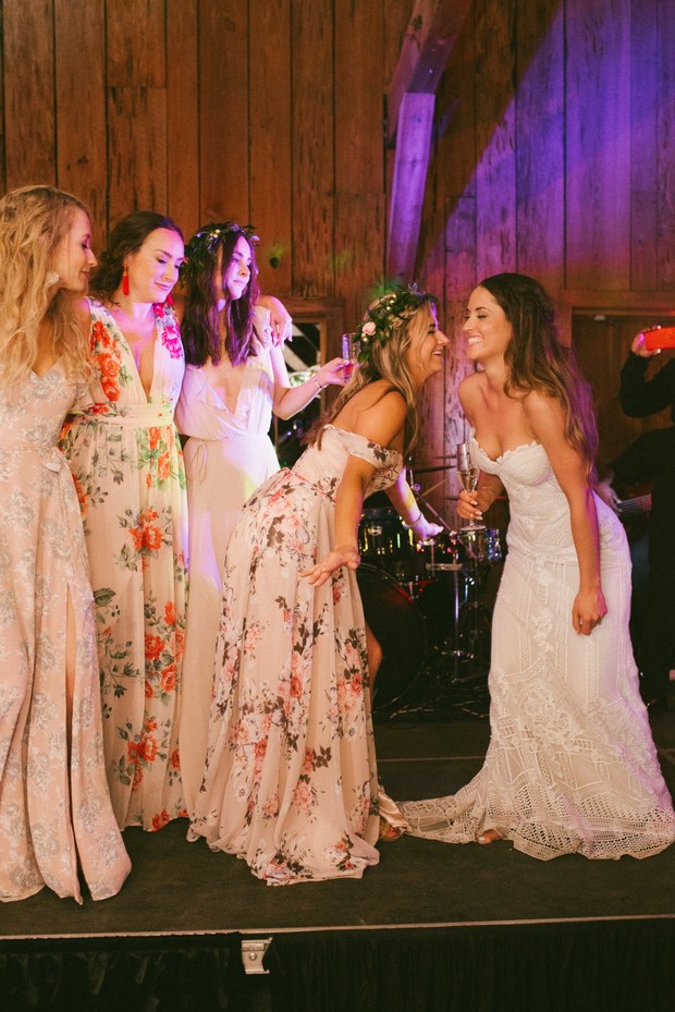 Bride and bridesmaids celebrate at wedding reception