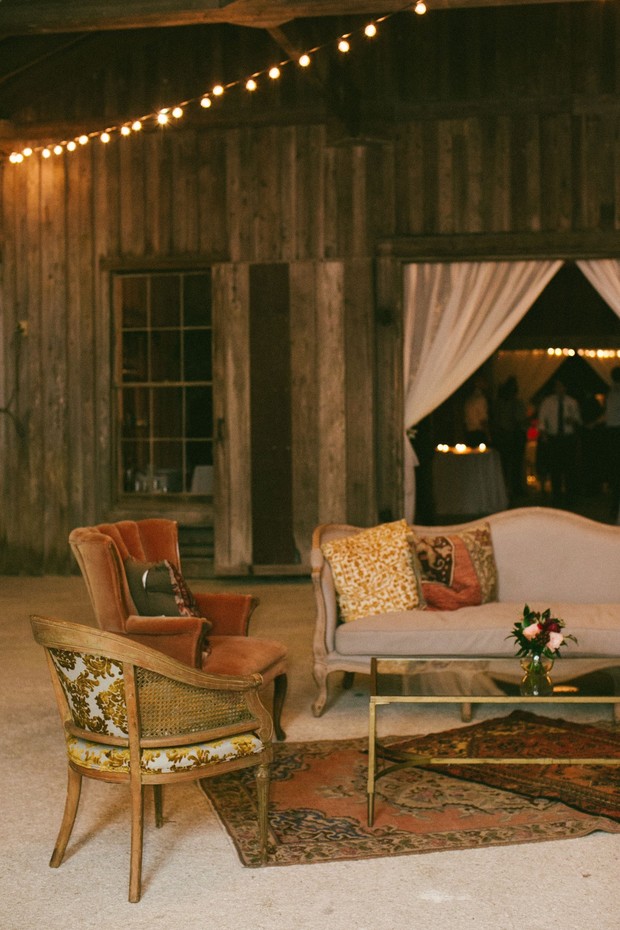 Rustic barn venue with vintage furniture and string lights