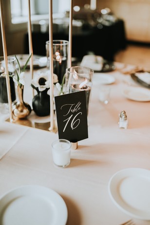 Elegant wedding table number sixteen floral centerpiece